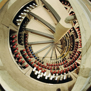 Illustration for article titled Door in the Floor Leads to Amazing Spiral Wine Dungeon